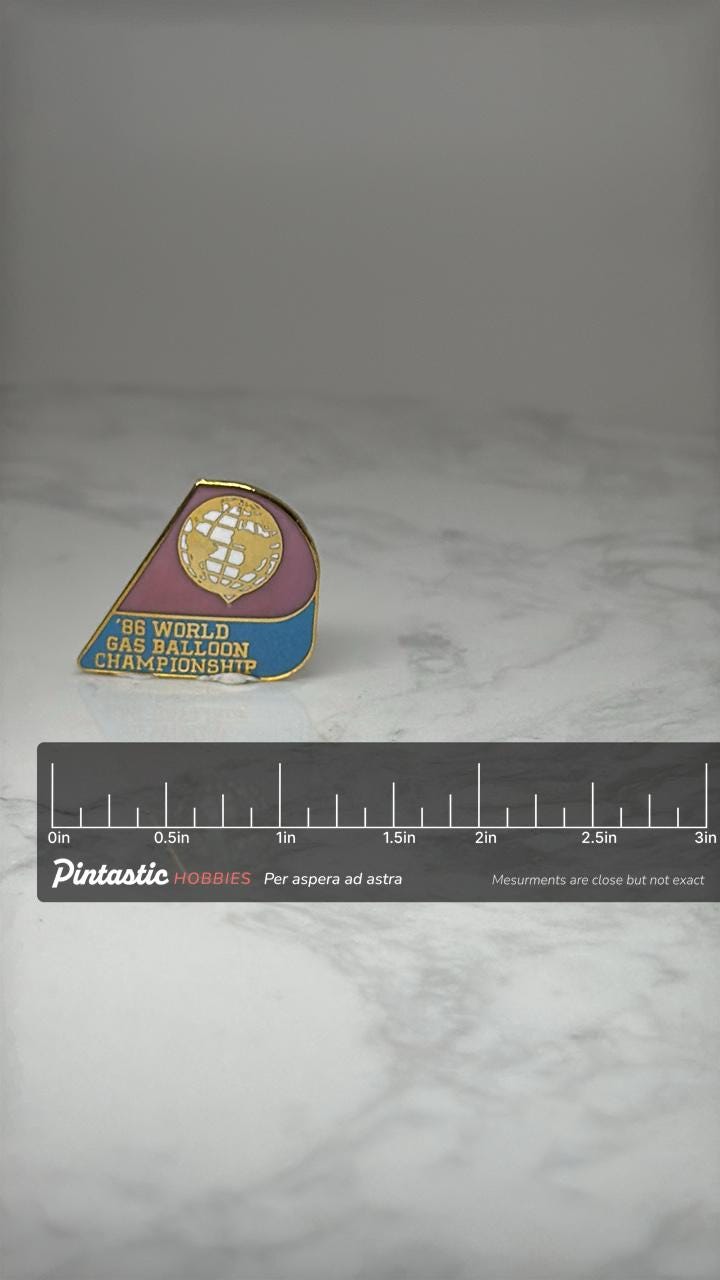 1986 World Gas Balloon Championship Pin: Enamel Gold Tone - Aviation Souvenir with ruler overlay for size reference