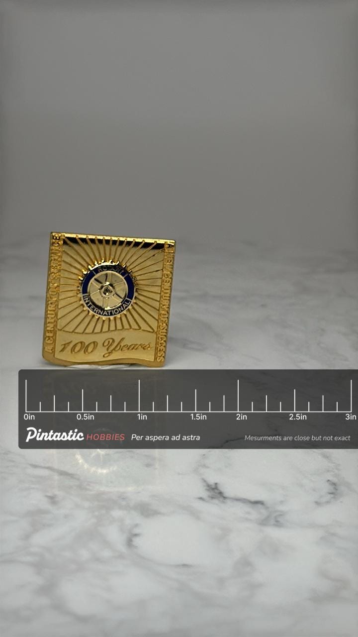 Rotary International 100 Years Lapel Pin: Gold Tone - Centennial Accessory with ruler overlay for size reference