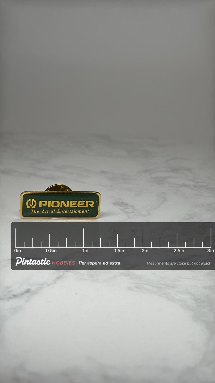 Pioneer Electronics Logo Pin: Green Gold Enamel - 1990s Promo with ruler overlay for size reference