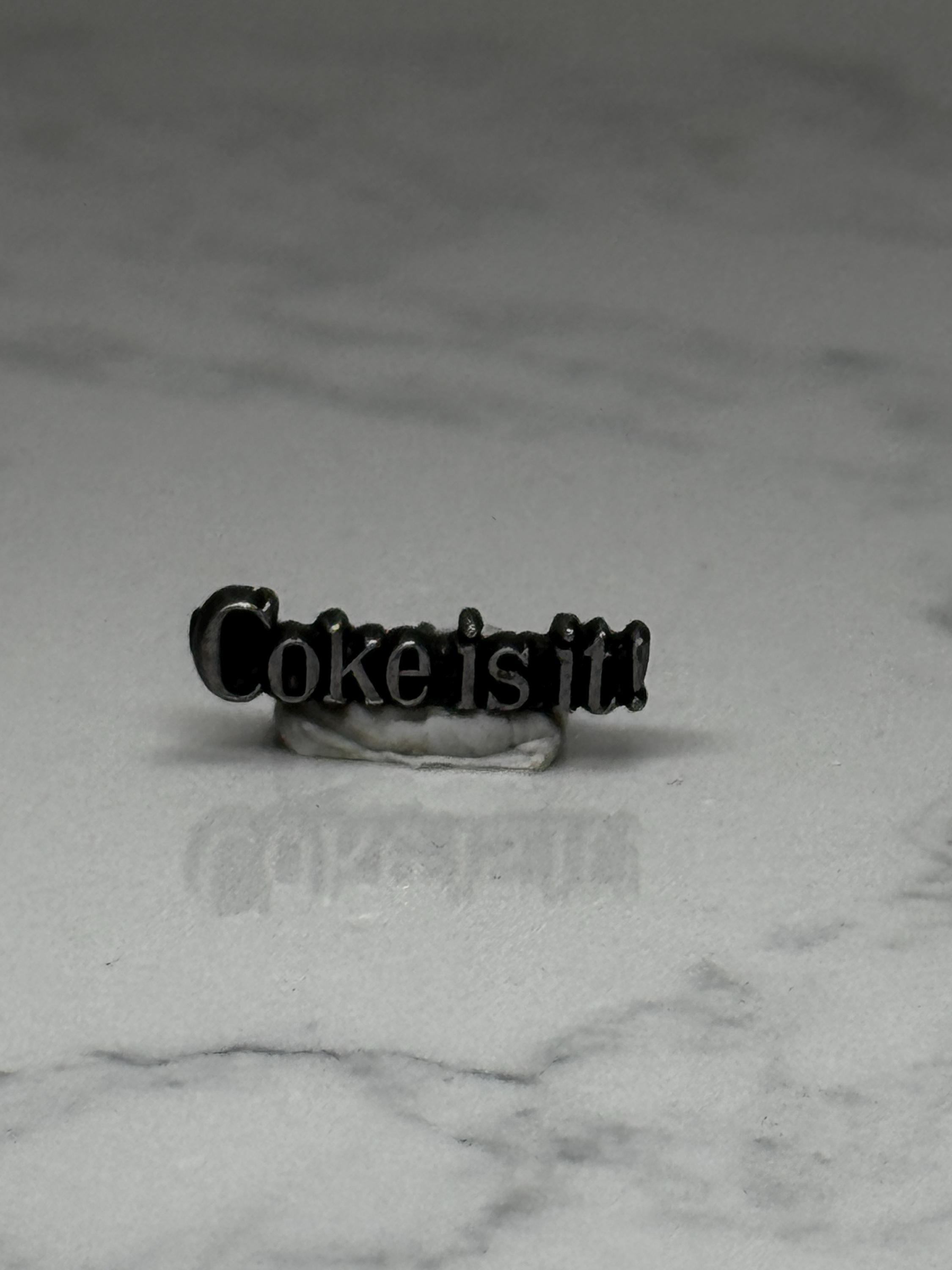 Coke is it! Slogan Pin: Black Enamel - 1980s Advertising Accessory