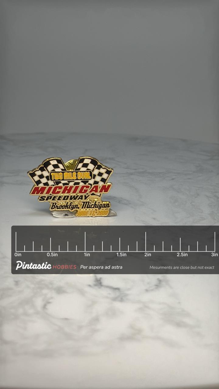 Michigan Speedway Two Mile Oval Pin: Gold Enamel - 2000 Racing Souvenir with ruler overlay for size reference