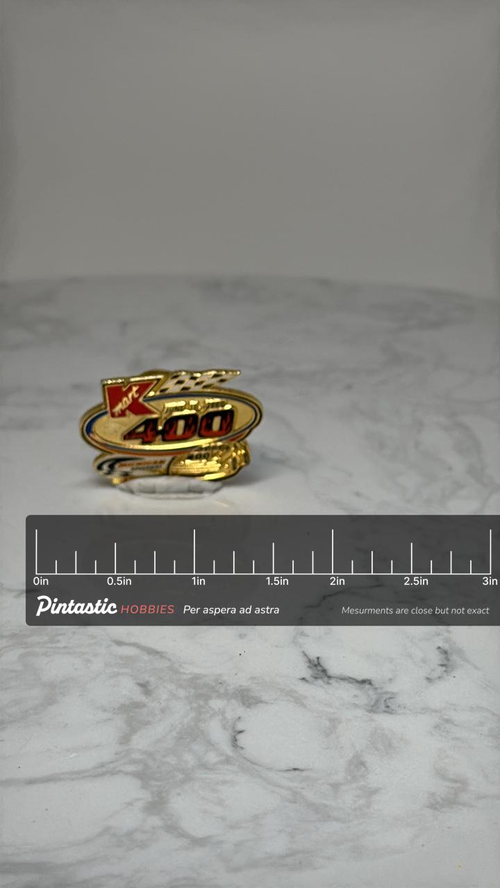 Kmart 400 NASCAR Pin: Gold Tone - 2000 Michigan Speedway Accessory with ruler overlay for size reference