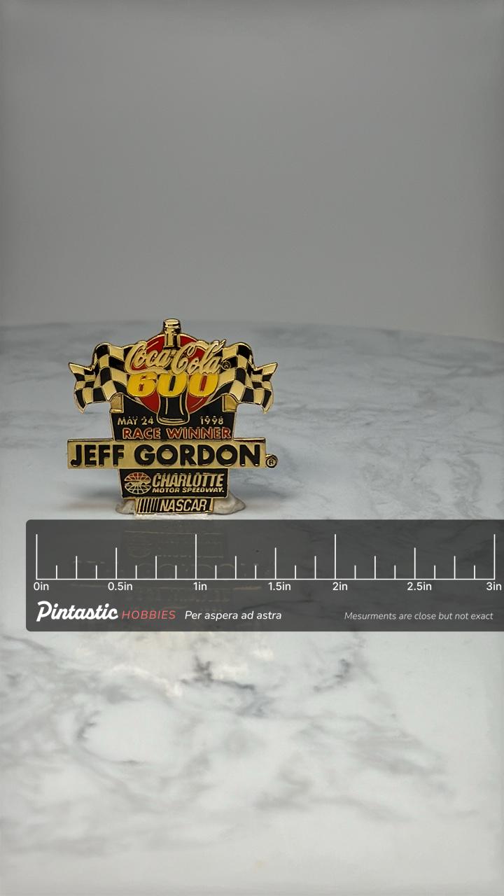 Coca-Cola 600 NASCAR Pin: Gold Tone - 1998 Race Winner Accessory with ruler overlay for size reference