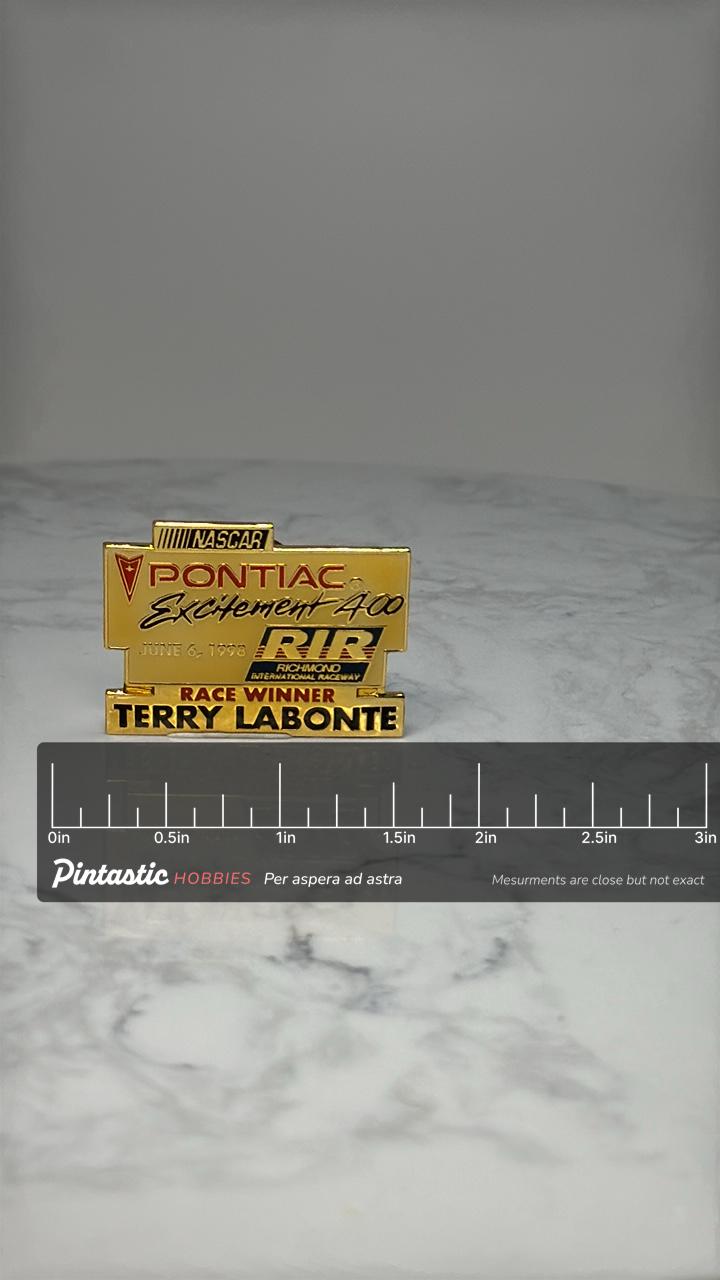 NASCAR Pontiac Excitement 400 Pin: Gold Tone - 1998 RIR Winner with ruler overlay for size reference