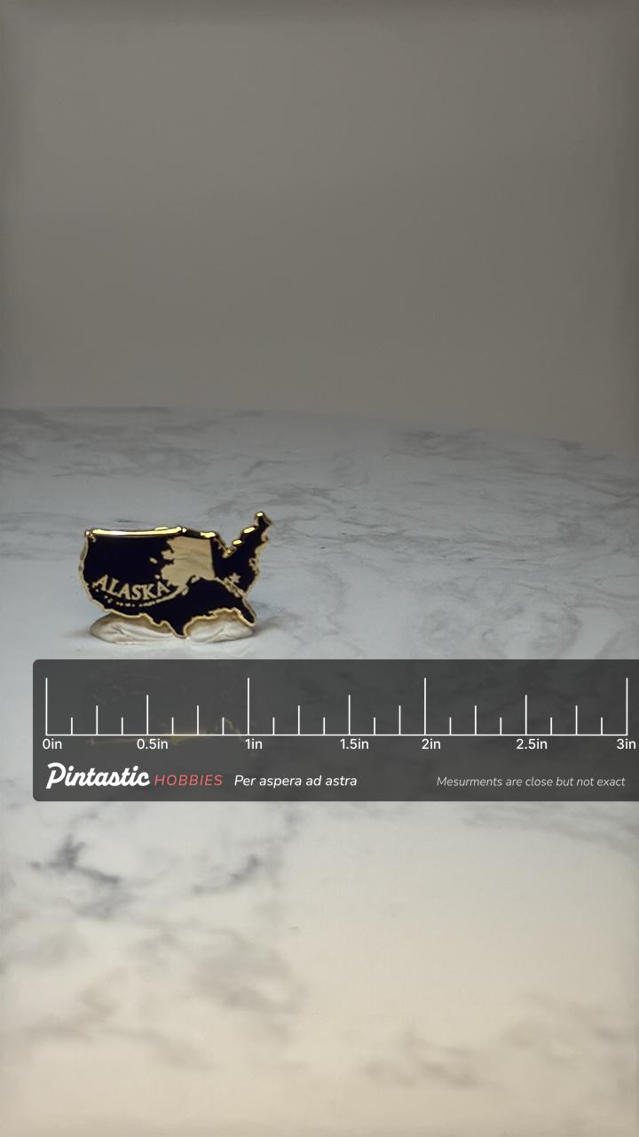 Alaska USA Map Enamel Pin: Black & Gold - State Travel Accessory with ruler overlay for size reference
