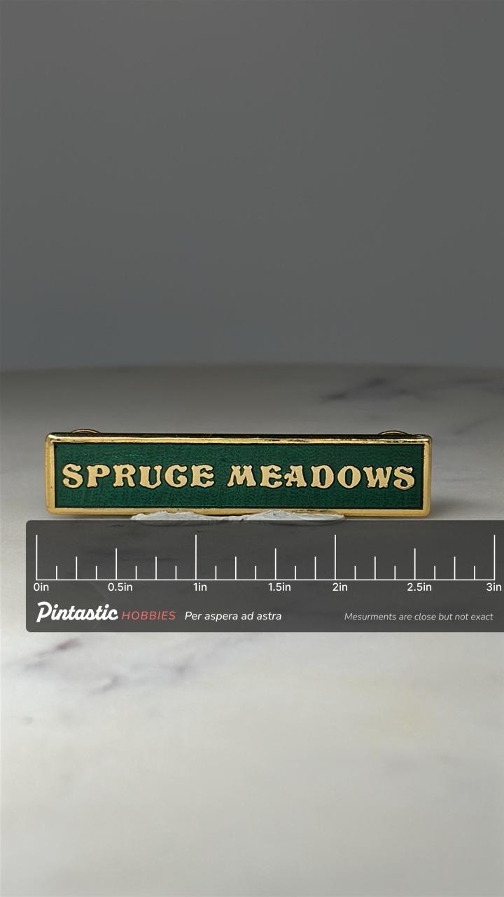 Spruce Meadows Name Bar Pin: Green & Gold Enamel - Equestrian with ruler overlay for size reference