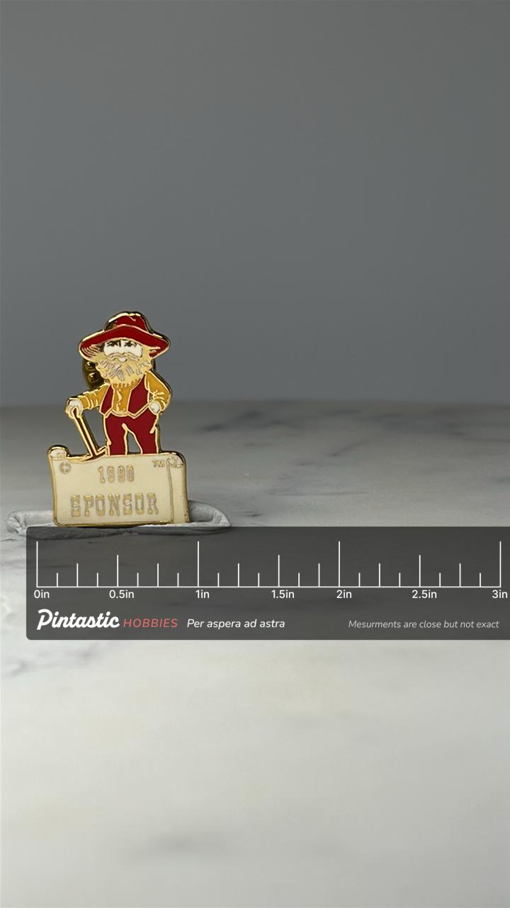 North Edmonton Klondike Days Sponsor Pin: Red Enamel - 1900 Sponsor Accessory with ruler overlay for size reference