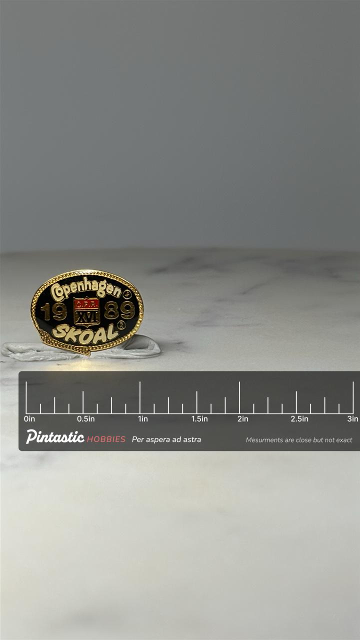 Copenhagen Skoal Pin: Black Gold 1989 CFR XVI Tobacco Promo with ruler overlay for size reference