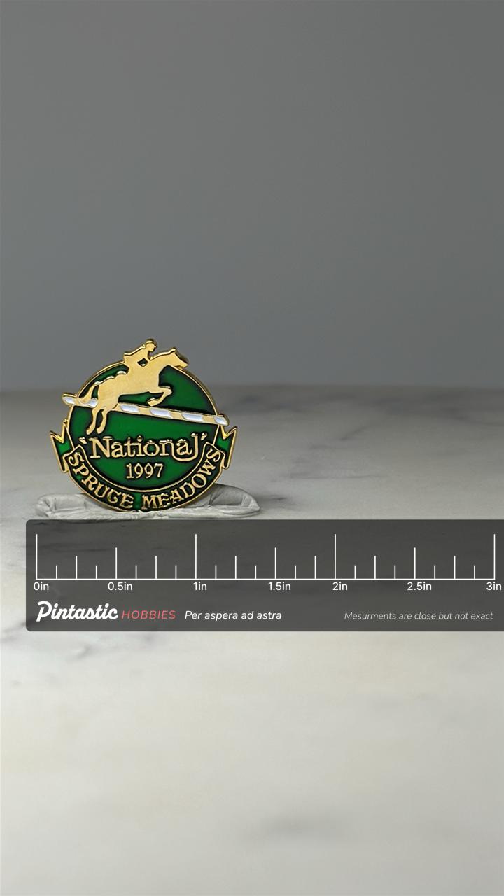 Spruce Meadows National Pin: Green Gold Enamel - 1997 Equestrian with ruler overlay for size reference