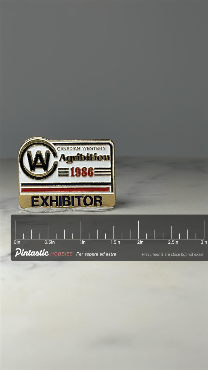 Canadian Western Agribition Pin: Gold Enamel - 1986 Exhibitor with ruler overlay for size reference