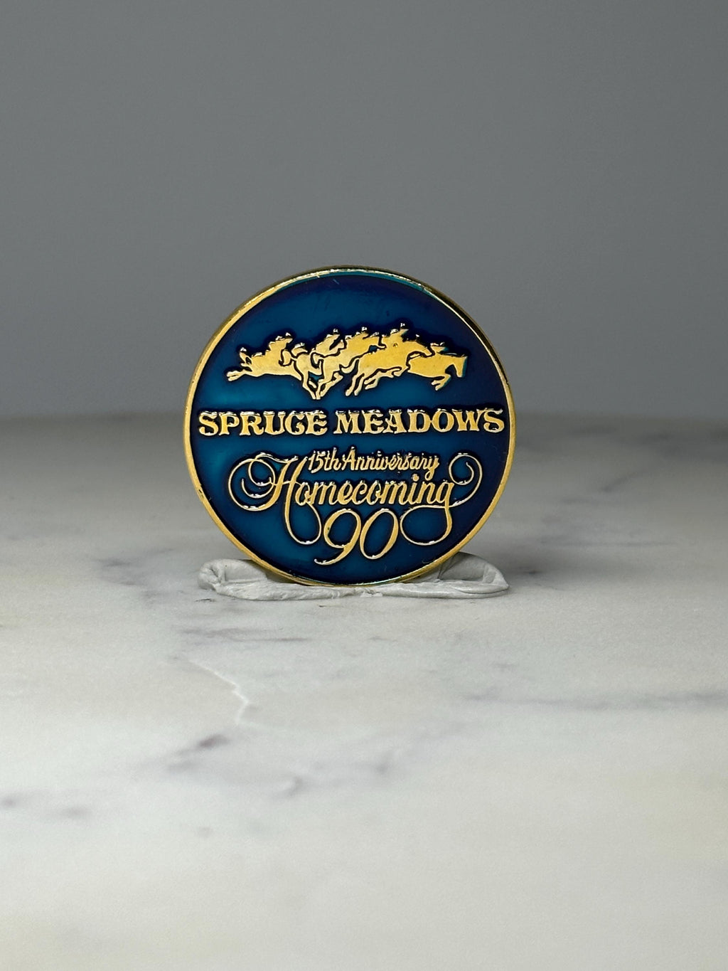 Spruce Meadows Homecoming Pin: Blue Gold Enamel - 1990 Anniversary