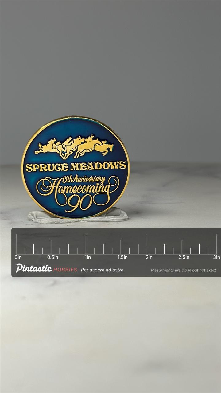 Spruce Meadows Homecoming Pin: Blue Gold Enamel - 1990 Anniversary with ruler overlay for size reference
