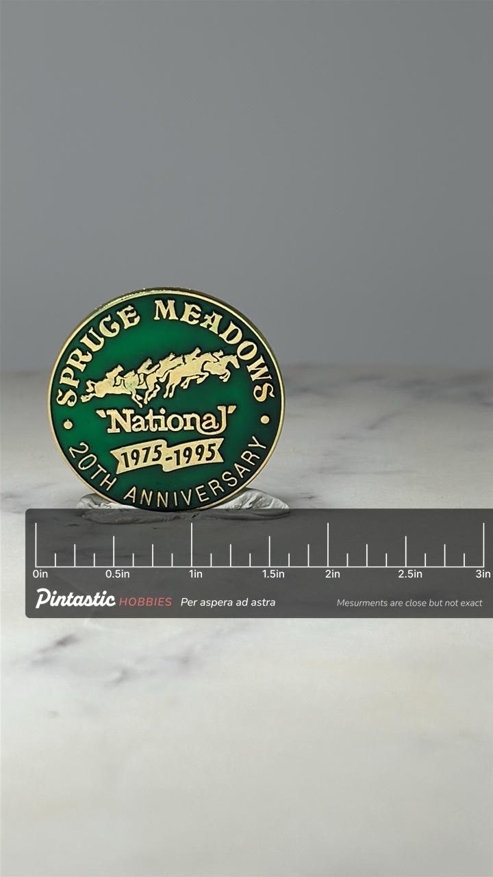 Spruce Meadows National Lapel Pin: Green Enamel - 20th Anniversary with ruler overlay for size reference