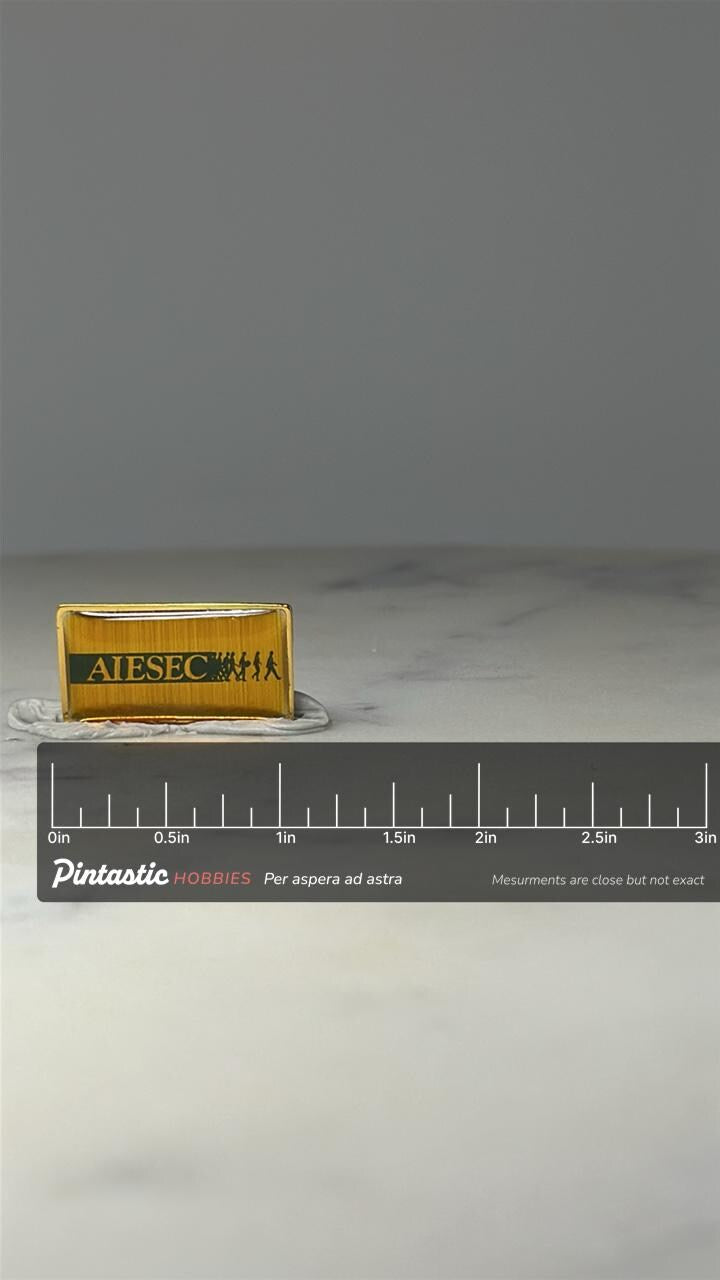 AIESEC Organization Pin: Gold Tone Enamel - Vintage Career Accessory with ruler overlay for size reference
