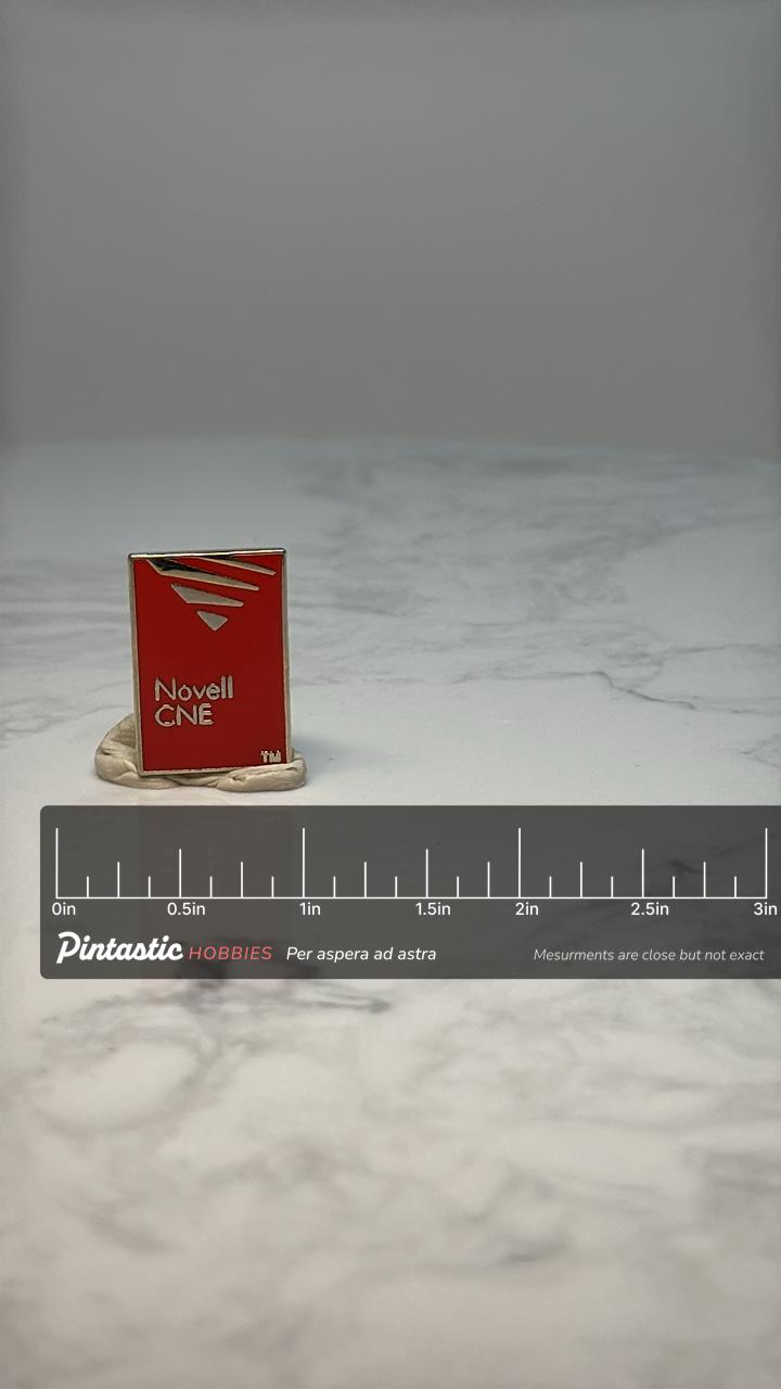 Novell CNE Enamel Pin: Red & Gold Corporate - 1990s Tech Accessory with ruler overlay for size reference