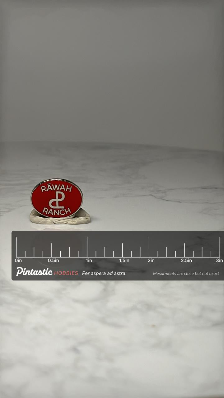 Rawah Ranch Souvenir Pin: Red Enamel Oval - Western Ranch Accessory with ruler overlay for size reference