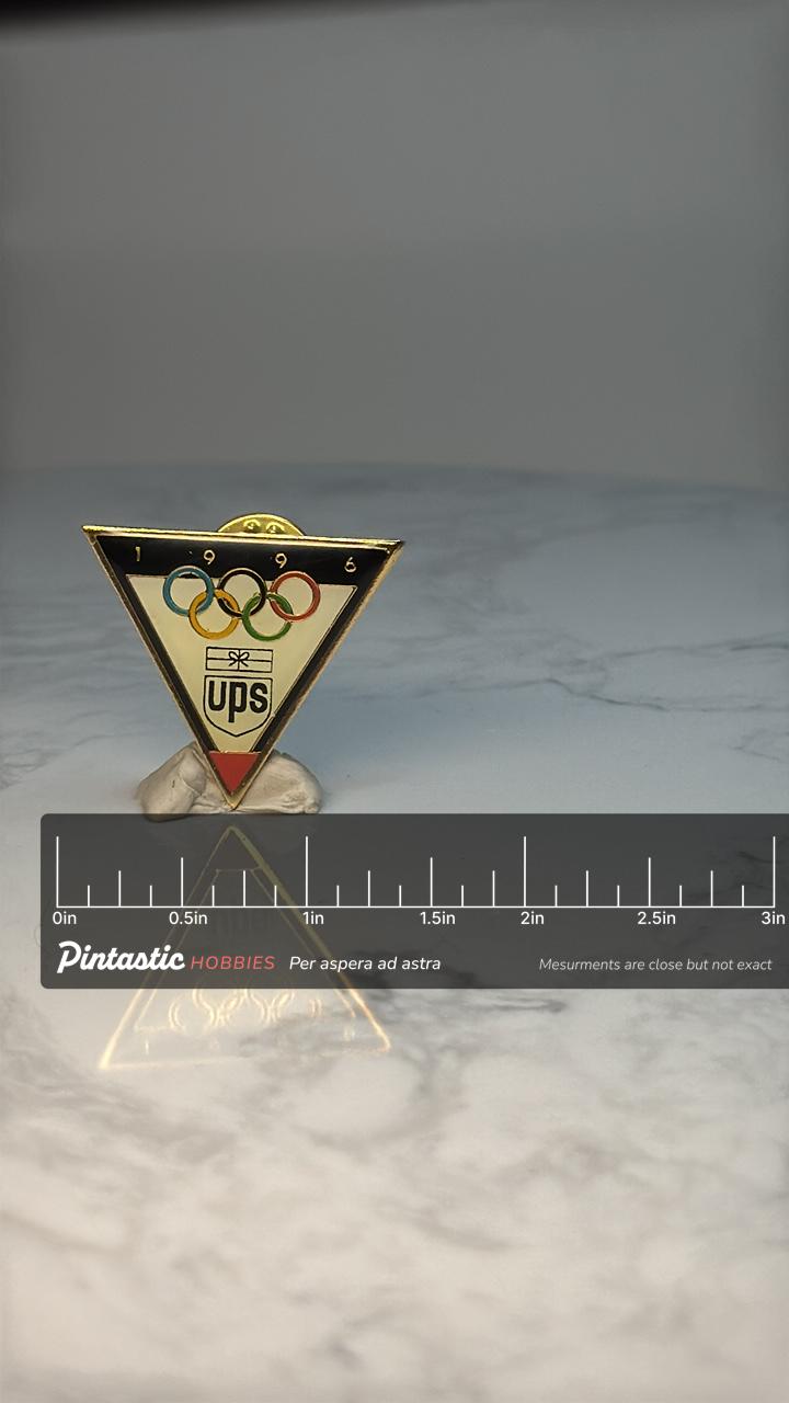 1996 Atlanta Olympics UPS Sponsor Pin: Gold Tone Enamel - Sports Souvenir Accessory with ruler overlay for size reference