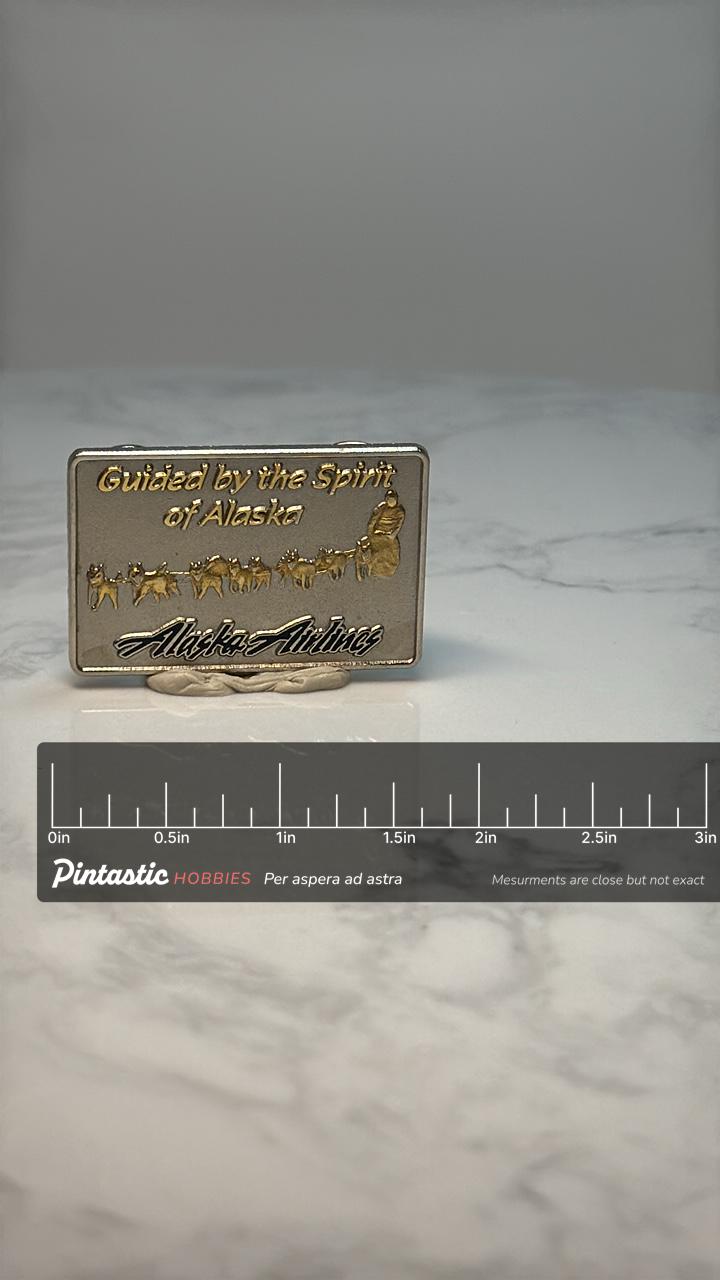 Alaska Airlines Souvenir Pin: Gold Tone Sled Dogs - Travel Accessory with ruler overlay for size reference