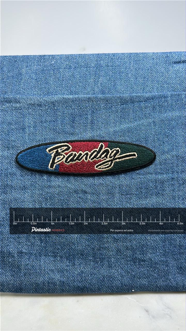 Vintage Bandag Patch: Tire Retread Company Logo - Automotive Badge with ruler overlay for size reference