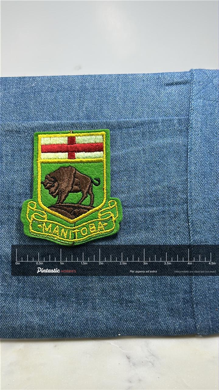 Manitoba Crest Collectable Patch: Green Gold - Canada Souvenir Accessory with ruler overlay for size reference