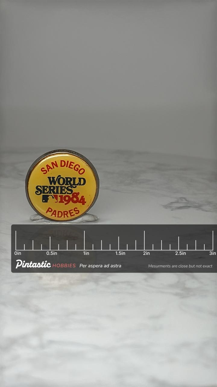 Vintage San Diego Padres Lapel Pin: Yellow Enamel - 1984 World Series with ruler overlay for size reference