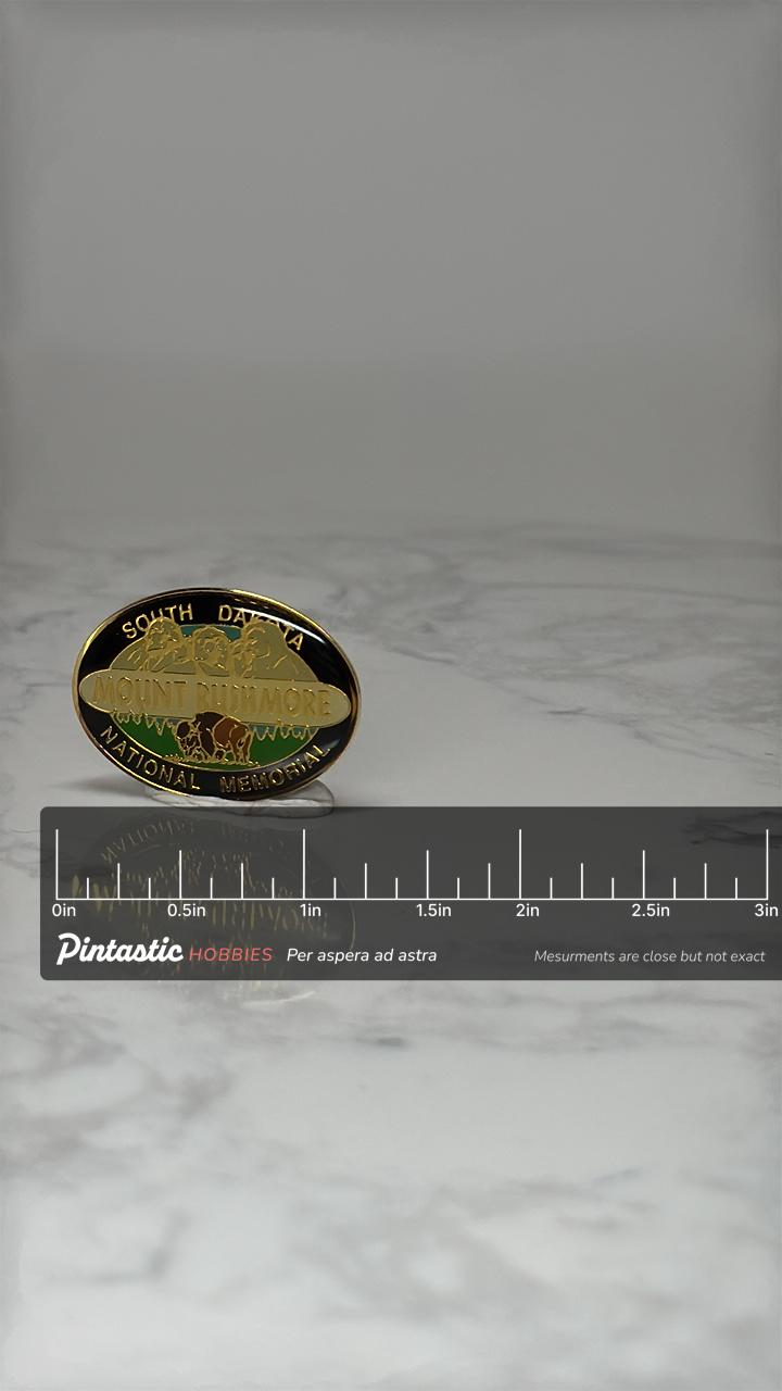 Vintage Mount Rushmore Souvenir Pin: Black & Gold Enamel - National Park Accessory with ruler overlay for size reference