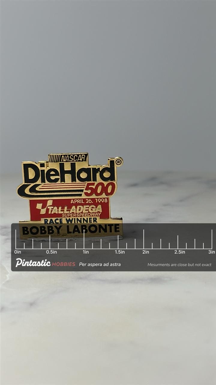 Vintage NASCAR DieHard 500 Pin: Gold Enamel - 1998 Race Winner with ruler overlay for size reference