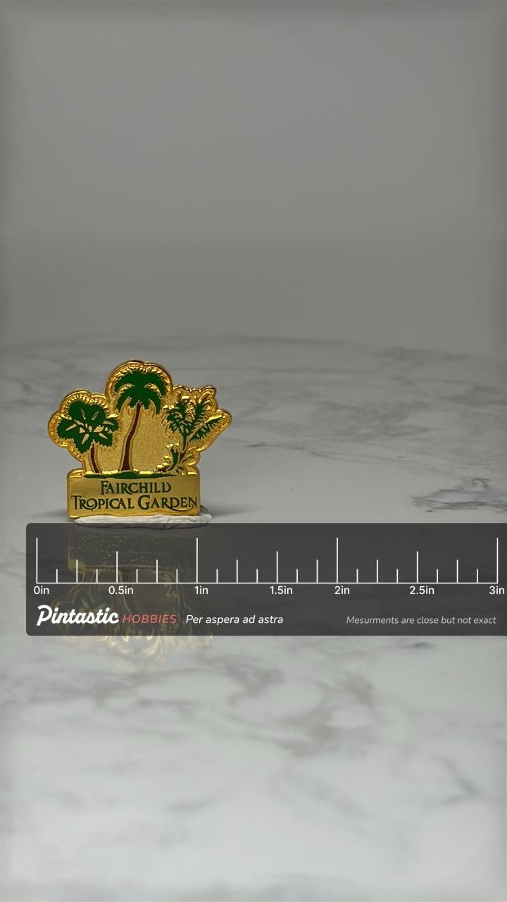 Vintage Fairchild Tropical Garden Lapel Pin: Gold & Green - Florida Souvenir with ruler overlay for size reference