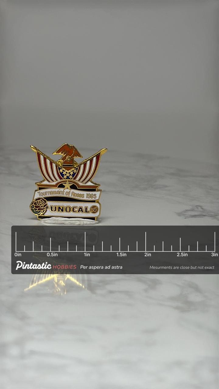 Vintage Tournament of Roses Lapel Pin: Gold Tone Enamel - 1985 UNOCAL with ruler overlay for size reference