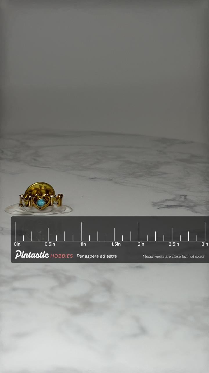 Vintage Mom Heart Lapel Pin: Gold Tone Blue Stone - Mothers Day Accessory with ruler overlay for size reference