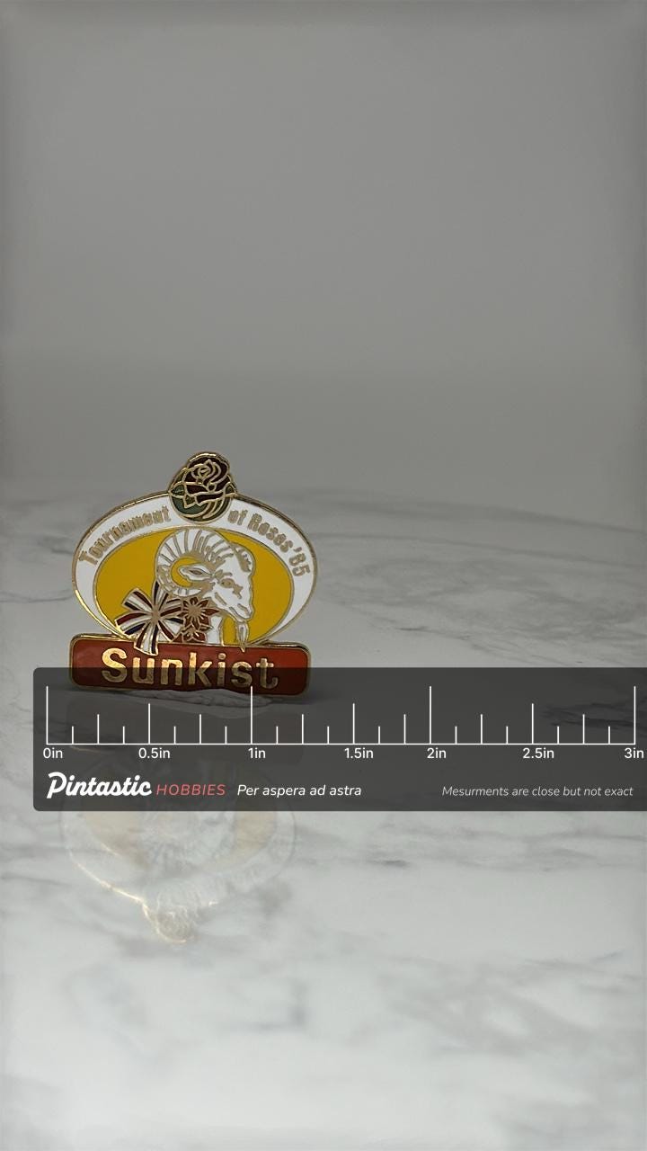 Vintage Sunkist Tournament of Roses Pin: Gold Enamel - 1985 Event Accessory with ruler overlay for size reference