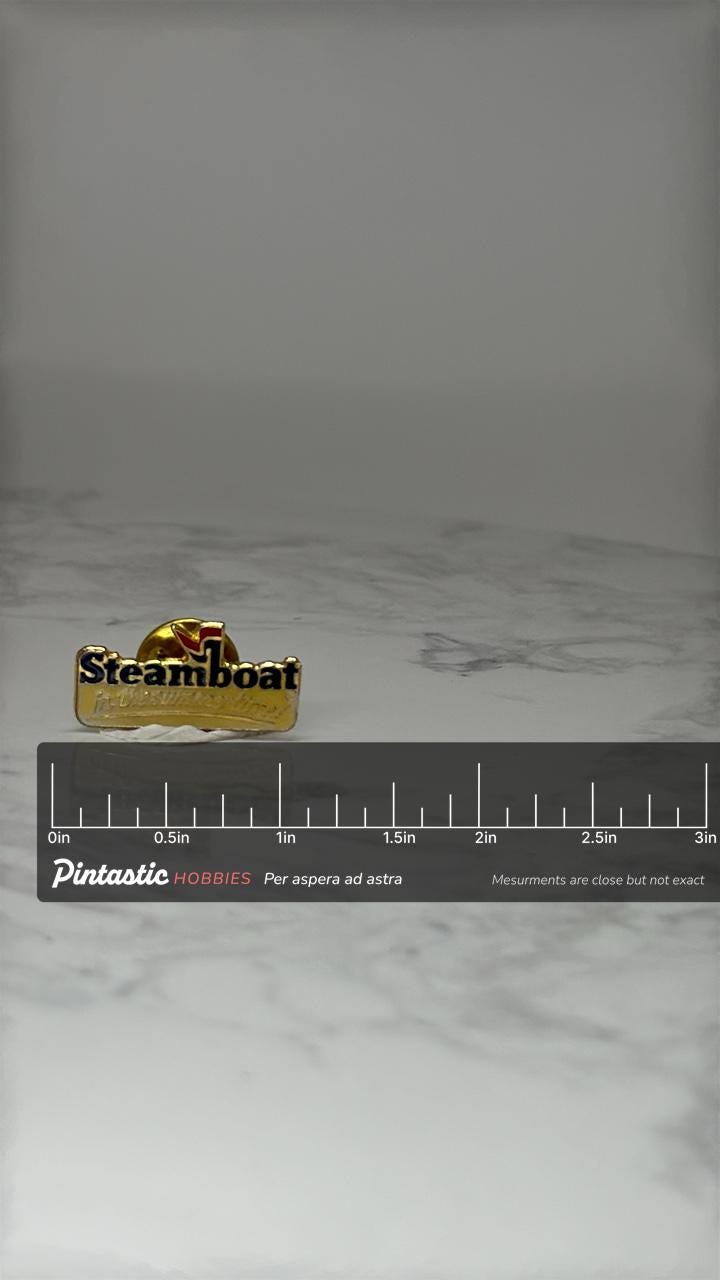 Vintage Steamboat Ski Resort Pin: Gold Tone Enamel - 1990s Travel Accessory with ruler overlay for size reference