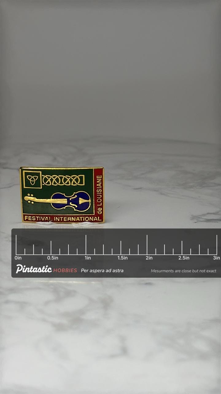 Vintage Festival International Pin: Gold Tone Enamel - Louisiana Music with ruler overlay for size reference