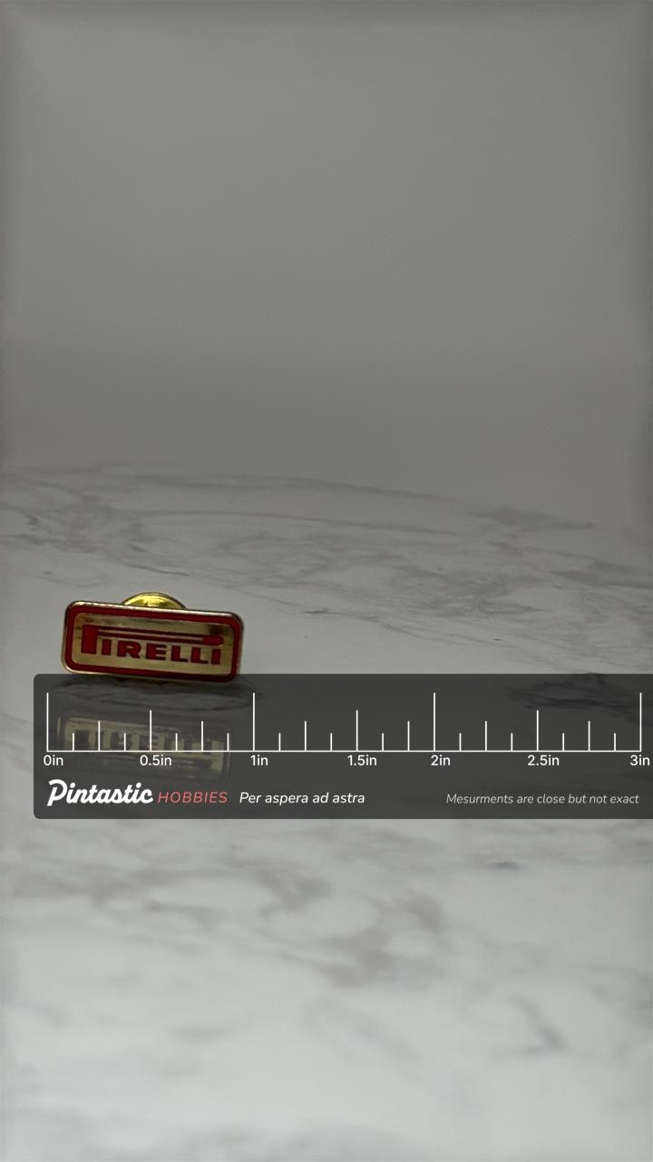 Vintage Pirelli Logo Lapel Pin: Red & Gold Enamel - Racing Era Accessory with ruler overlay for size reference