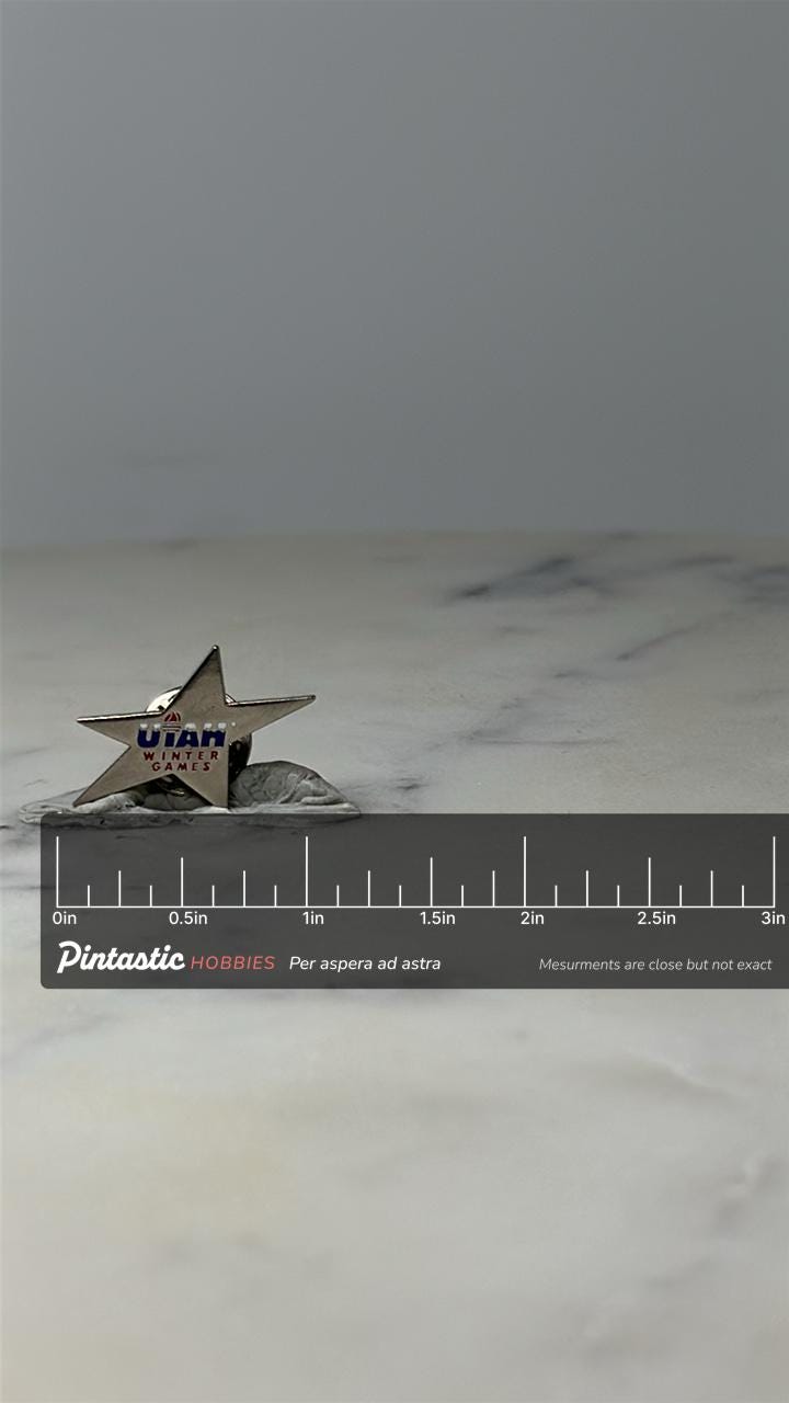 Vintage Utah Winter Games Star Lapel Pin: Silver Tone - 1990s Sports Accessory with ruler overlay for size reference