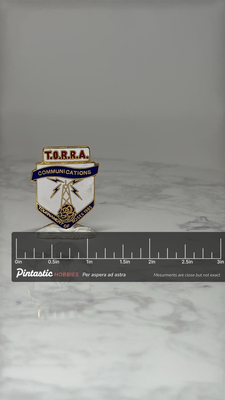 Vintage T.O.R.R.A. Communications Pin: Gold Enamel - 1985 Rose Parade with ruler overlay for size reference