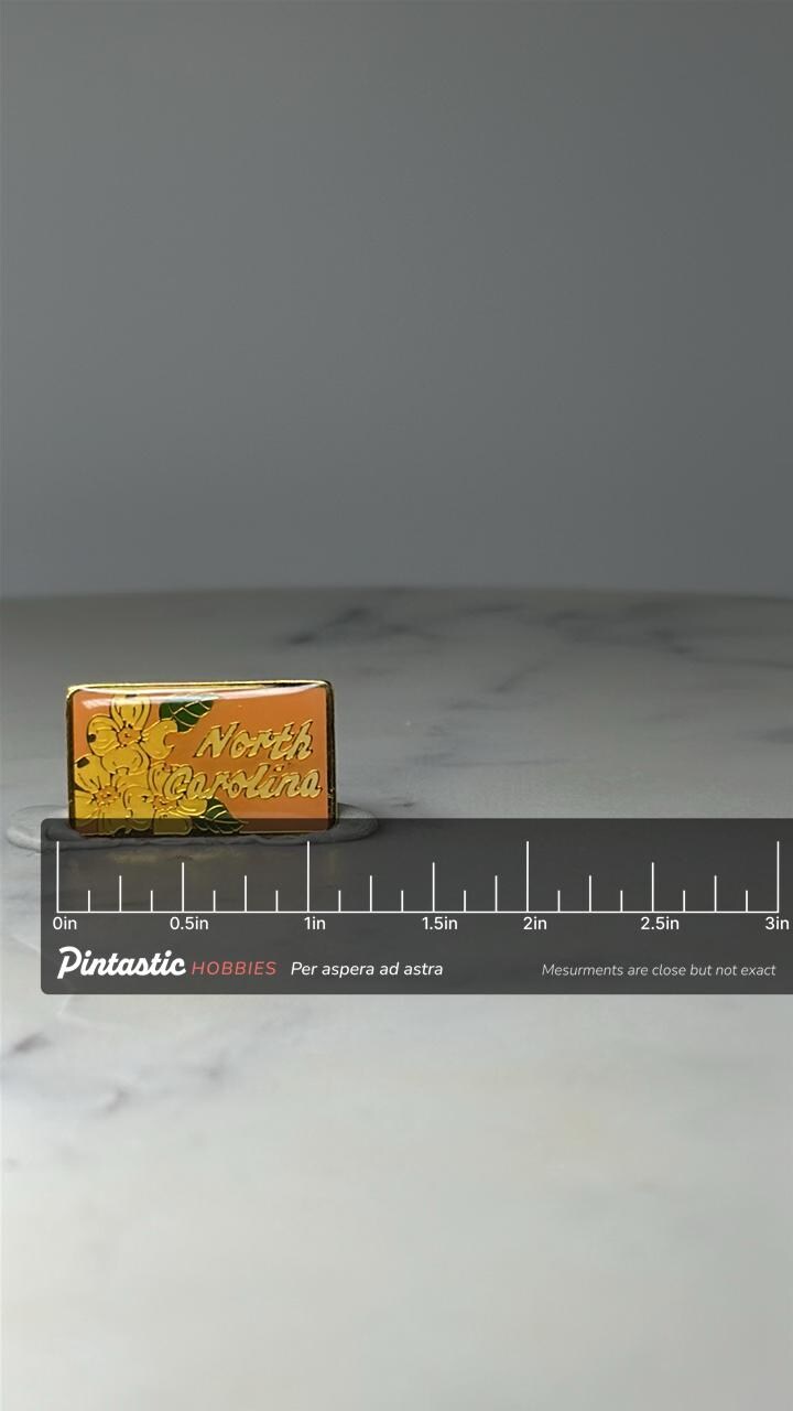Vintage North Carolina Souvenir Pin: Gold Tone Enamel - State Floral Accessory with ruler overlay for size reference