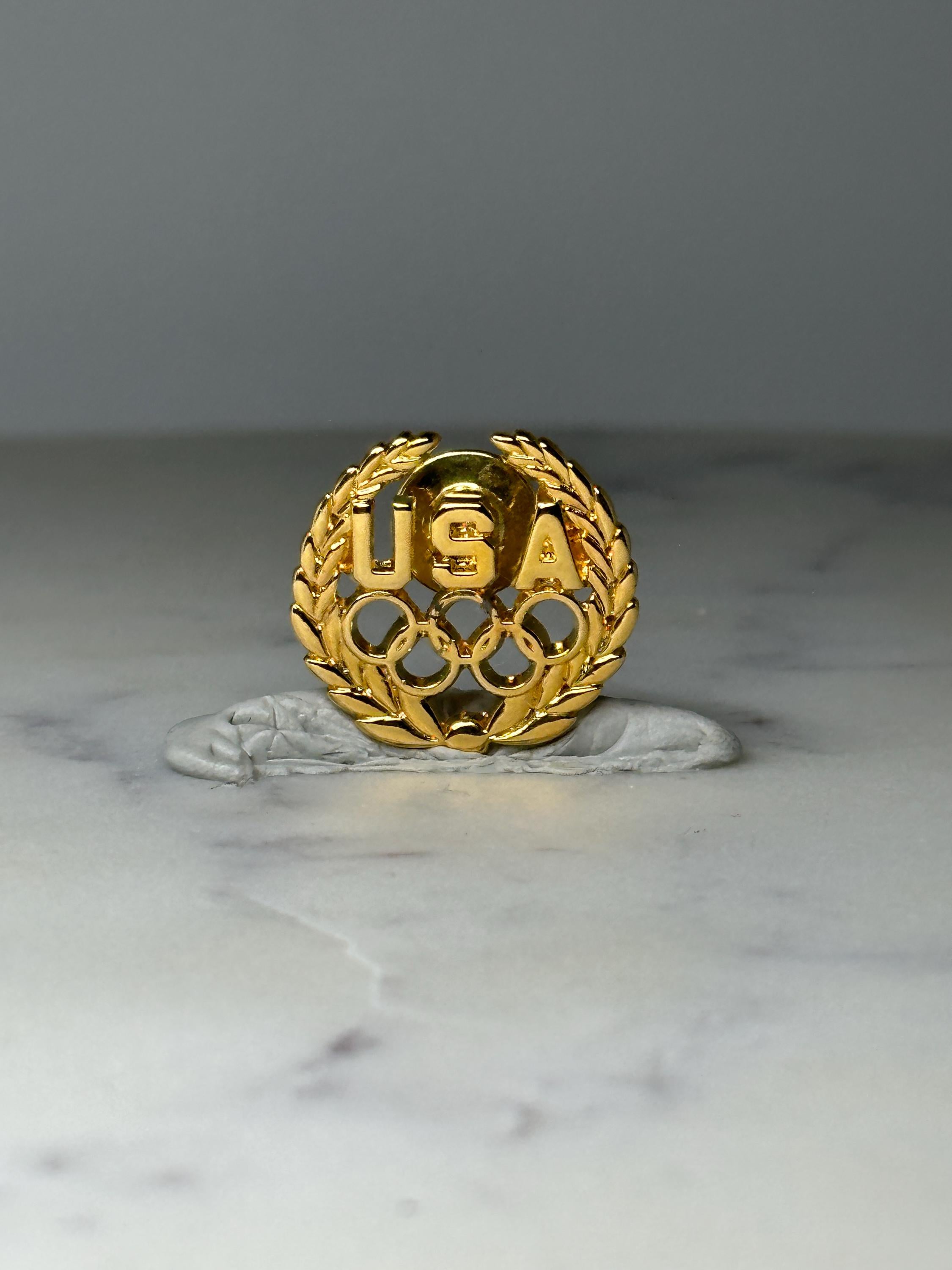 Vintage USA Olympic Rings Lapel Pin: Gold Tone - Patriotic Sports Accessory