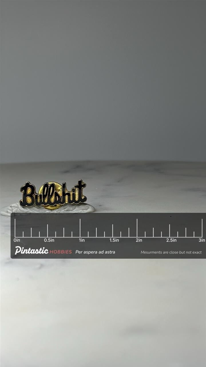 Vintage Bullshit Phrase Pin: Black Enamel - 1990s Novelty Accessory with ruler overlay for size reference