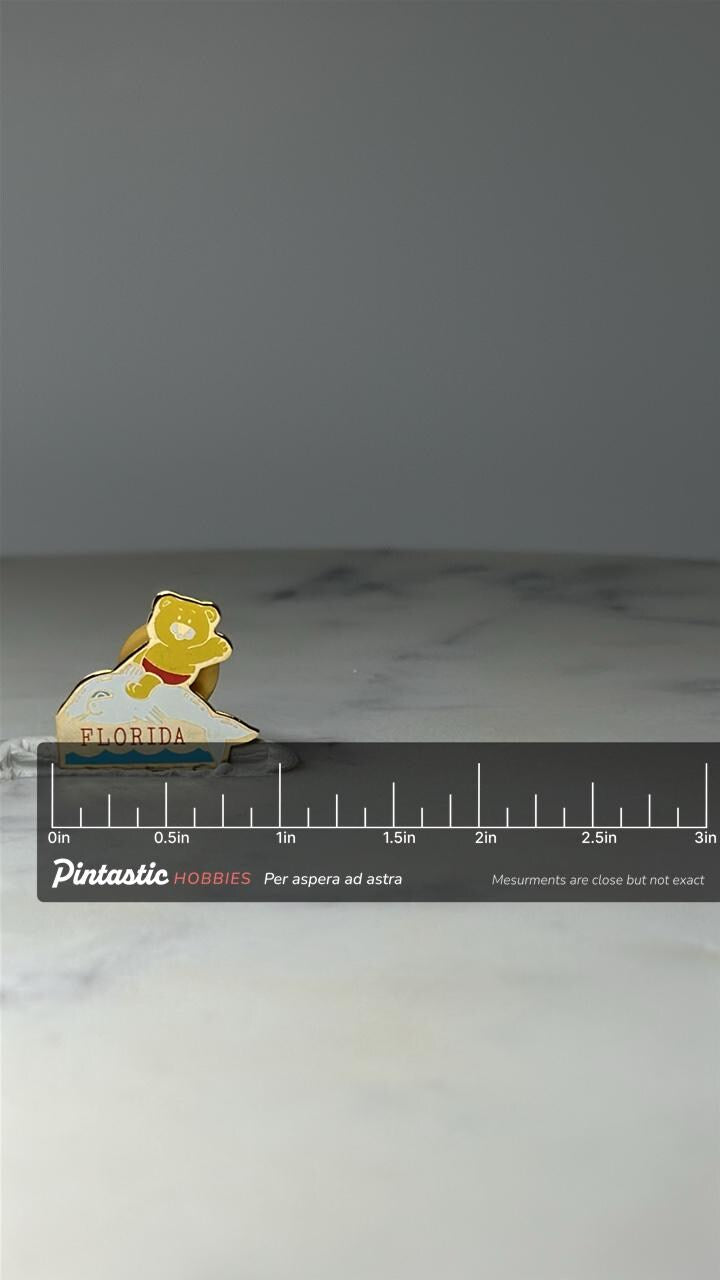 Vintage Florida Bear Dolphin Enamel Pin: Gold Tone - Souvenir Travel Accessory with ruler overlay for size reference