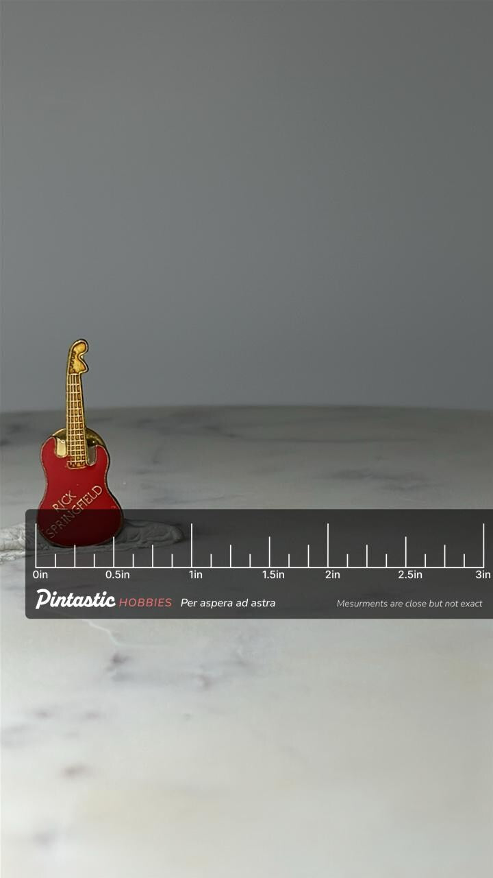 Vintage Rick Springfield Guitar Pin: Red Enamel - 1980s Music with ruler overlay for size reference