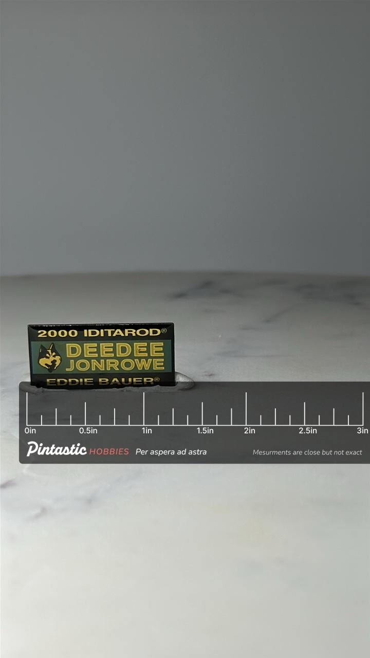 Vintage 2000 Iditarod Deedee Jonrowe Lapel Pin: Green Gold - Sled Dog Race Accessory with ruler overlay for size reference