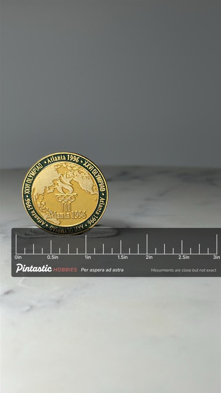 Vintage Atlanta 1996 Olympic Lapel Pin: Gold Tone Enamel - XXVI Olympiad Accessory with ruler overlay for size reference