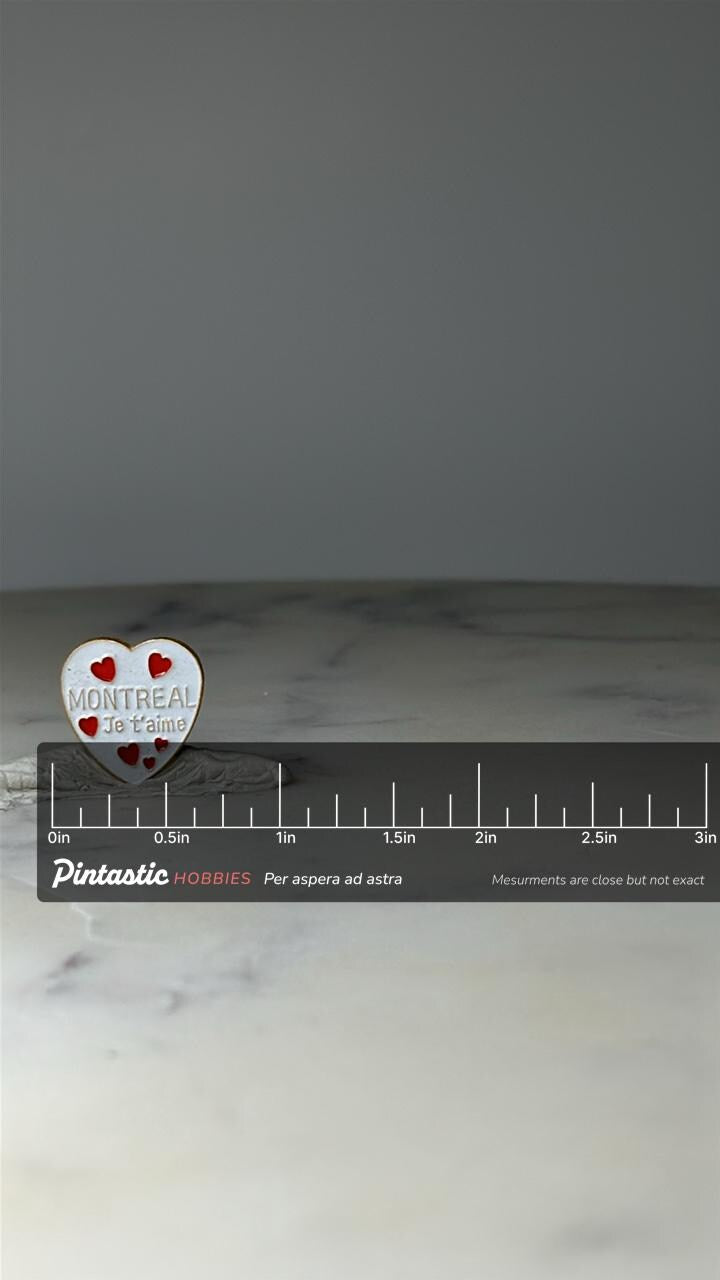 Vintage Montreal Souvenir Lapel Pin: White Enamel Heart - Canada Travel Accessory with ruler overlay for size reference