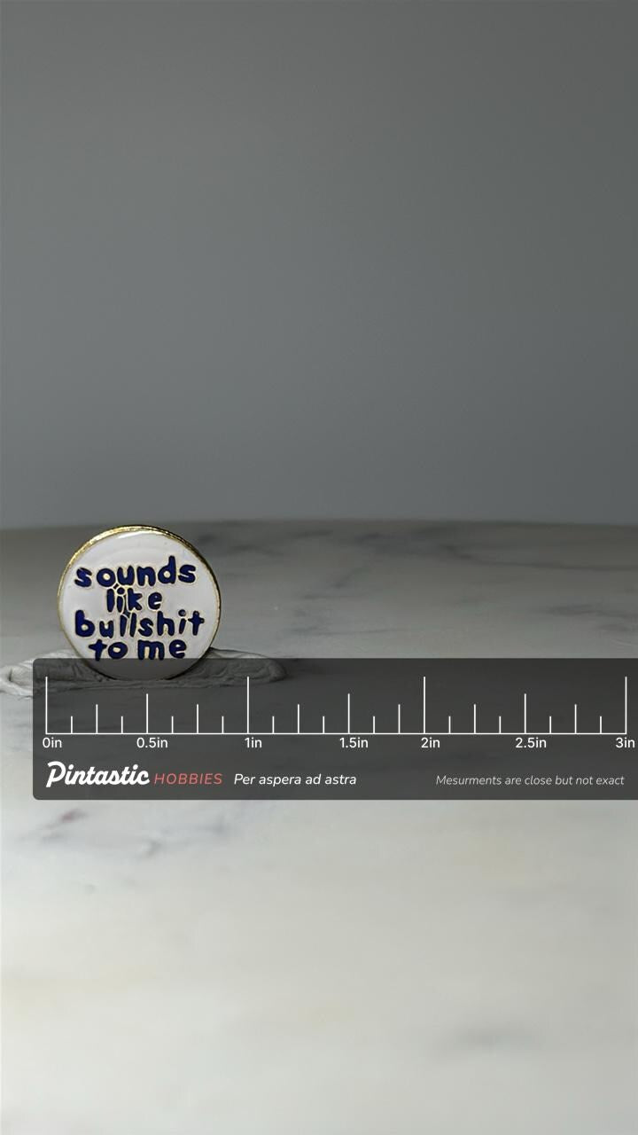 Vintage Sarcastic Phrase Enamel Pin: White & Blue - 1980s Novelty Accessory with ruler overlay for size reference
