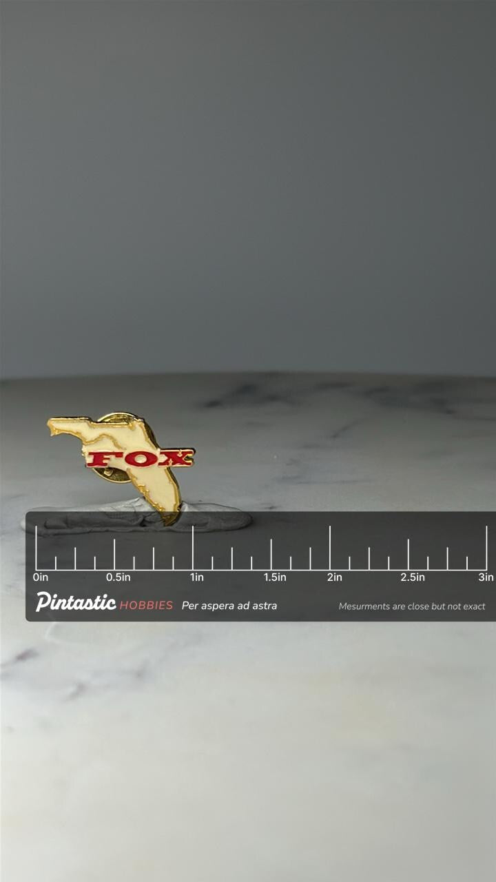 Vintage Florida FOX Enamel Lapel Pin: Gold Tone - 1990s TV Promo Accessory with ruler overlay for size reference