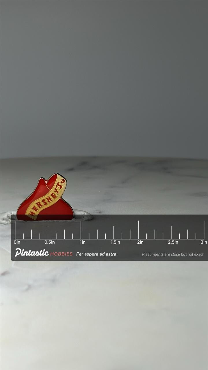 Vintage Hersheys Chocolate Kiss Lapel Pin: Red Enamel - Candy Brand Accessory with ruler overlay for size reference