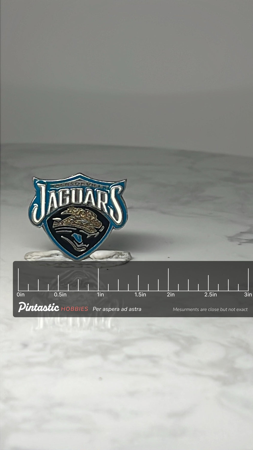 Vintage Jacksonville Jaguars Enamel Pin: Teal & Black - NFL Football Accessory with ruler overlay for size reference
