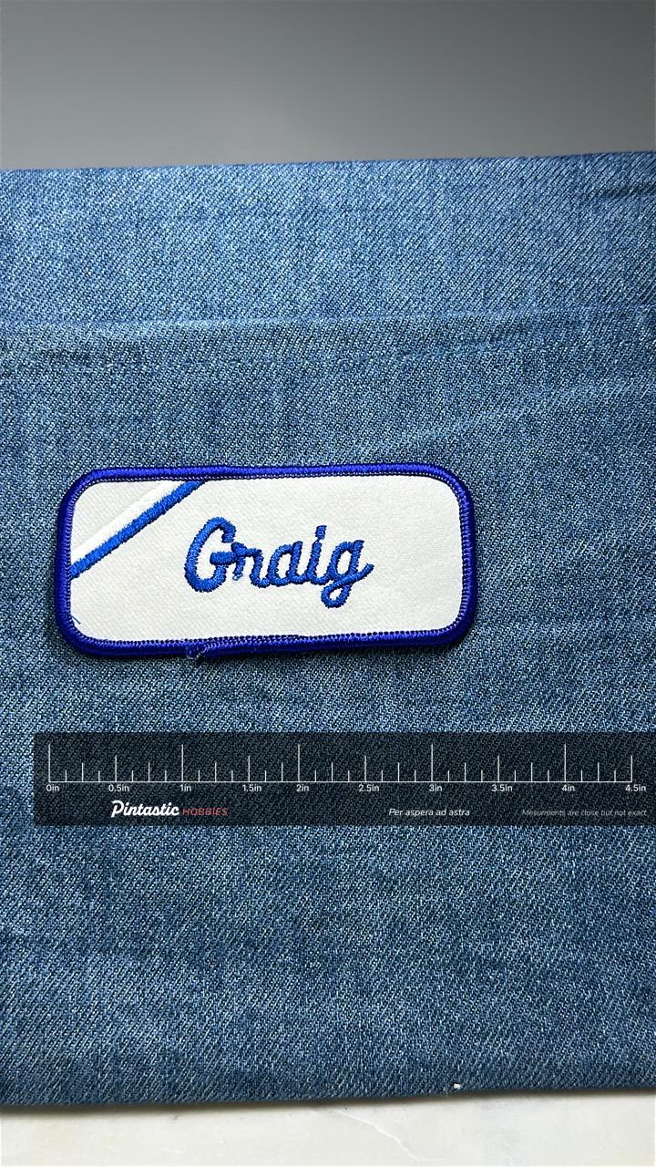 Craig Name Patch: Blue Script on White - Vintage Uniform Accessory with ruler overlay for size reference