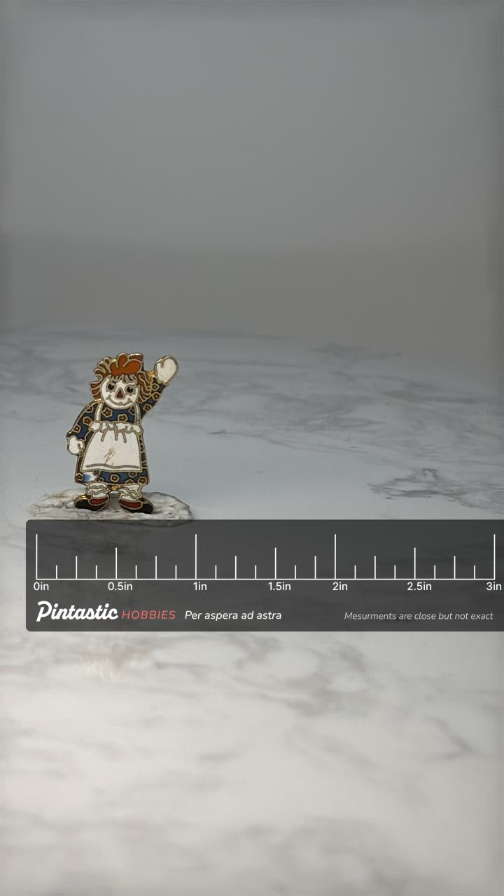 Vintage Raggedy Ann Enamel Pin: Gold Tone - 1980s Character Accessory with ruler overlay for size reference